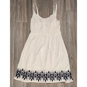 Charming White Summer Dress with Embroidered Hemline